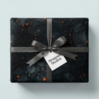 Elegant luxury gift wrap with an abstract dark pattern, tied with a gray satin ribbon and bow.