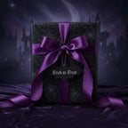 Halloween gift wrapped in black spiderweb paper with a purple satin ribbon and "Trick or Treat" bat tag.