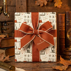 Vintage science wrapping paper with chemistry beaker pattern and rust orange bow, by Wrapped Studios.