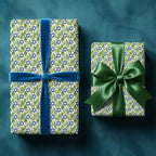 Elegant Hanukkah wrapping paper with Star of David botanical print and blue velvet ribbon by Wrapped Studios.