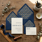 Elegant navy and gold Bar Mitzvah invitation with Star of David envelope liners by Wrapped Studios.