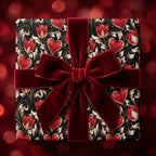 Luxury heart and floral wrapping paper with a red velvet bow by Wrapped Studios.