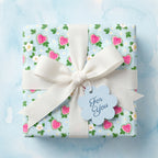 Cute heart watermelon wrapping paper with a white bow and gift tag by Wrapped Studios.