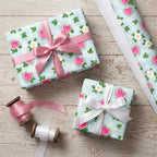 Cute watermelon floral wrapping paper on birthday gifts with satin ribbons by Wrapped Studios.