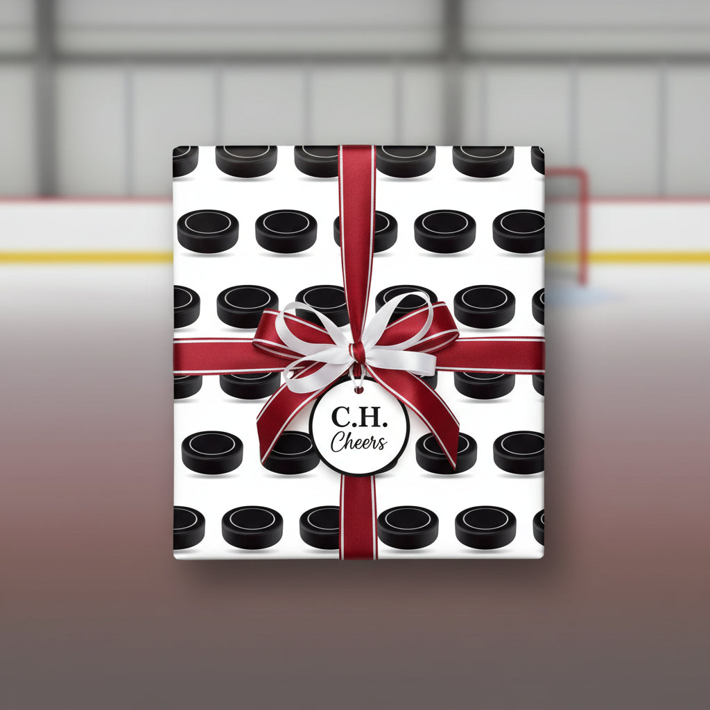 Hockey puck wrapping paper with a red and white ribbon, gift tag, and ice rink background.