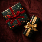 Festive Christmas gift wrap with bokeh lights pattern, red velvet and gold bows by Wrapped Studios.