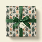 Vintage Christmas tree wrapping paper with a green satin bow and tag, by Wrapped Studios.