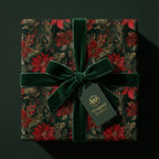 Elegant Christmas gift beautifully wrapped in floral wrapping paper with a velvet bow from Wrapped Studios.