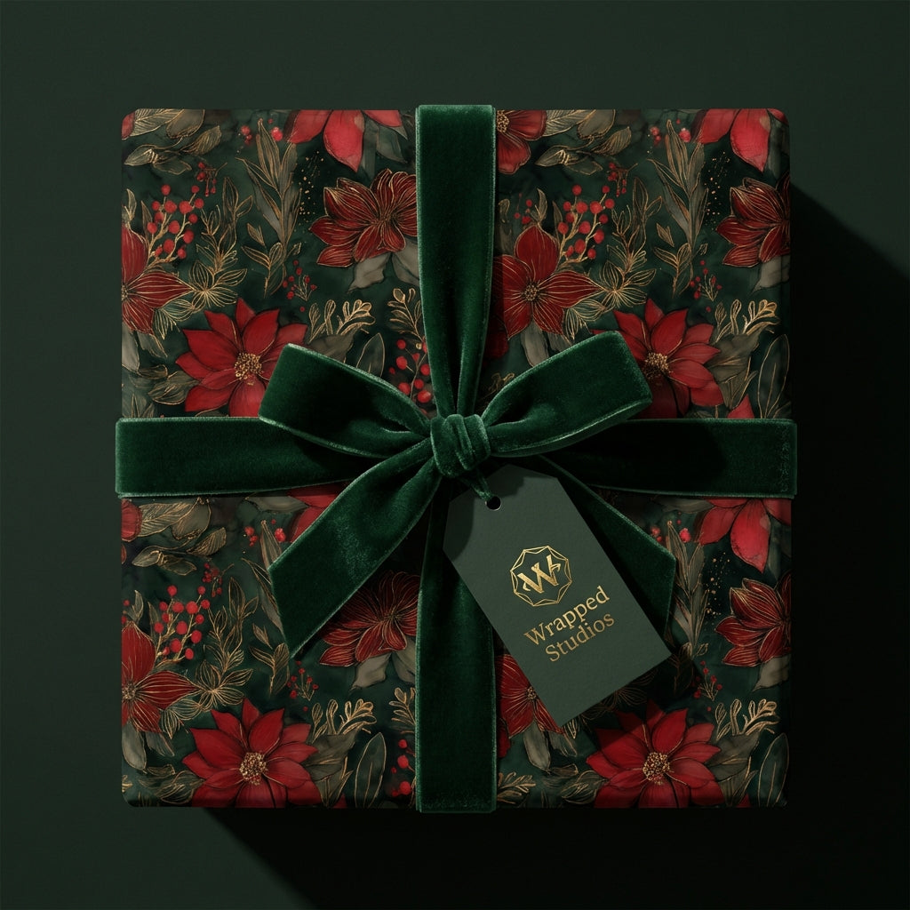 Elegant Christmas gift beautifully wrapped in floral wrapping paper with a velvet bow from Wrapped Studios.