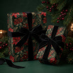 Christmas presents wrapped in floral poinsettia paper with black velvet ribbon, by Wrapped Studios.