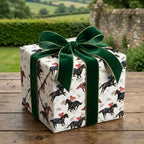 Vintage horse racing wrapping paper with a green velvet bow by Wrapped Studios.