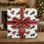 Equestrian Christmas wrapping paper featuring a vintage horse racing print and red bow by Wrapped Studios.