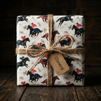 Vintage horse racing wrapping paper on a gift tied with rustic twine by Wrapped Studios.