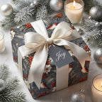 Luxury Christmas wrapping paper with bird and berry print, satin ribbon, and Joy gift tag by Wrapped Studios.