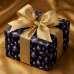 Luxury purple and gold ornament Christmas wrapping paper on a gift box with gold bow by Wrapped Studios.