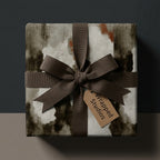 Rustic brown and cream abstract wrapping paper with a dark brown bow, by Wrapped Studios.