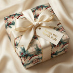 Luxury Christmas gift with Santa Claus wrapping paper and cream ribbon.