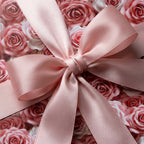 Pink rose floral luxury wrapping paper with a satin ribbon bow. Perfect for Mother's Day or wedding gifts.