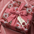 Blush rose floral gift wrap by Wrapped Studios with dusty pink velvet ribbon and 'For You' tag for elegant gifts.