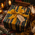 Kwanzaa gift wrapped in ethnic-patterned paper with a gold velvet ribbon and "For You" tag.