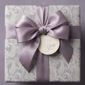 Lavender paisley luxury wrapping paper with a satin bow and "For You" gift tag by Wrapped Studios.