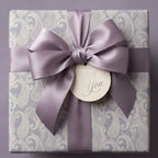 Lavender paisley luxury wrapping paper with a satin bow and "For You" gift tag by Wrapped Studios.