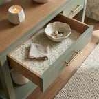 Sage green botanical wrapping paper from Wrapped Studios styled as an elegant drawer liner.