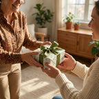 Woman receiving a gift in botanical floral wrapping paper with green satin bow by Wrapped Studios.