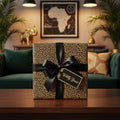 Chic gift box wrapped in leopard print wrapping paper with black ribbon and "Wildly Yours" tag.