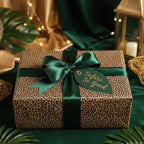 Leopard print wrapping paper with emerald ribbon and "Safari So Good" tag, perfect for a unique birthday gift.