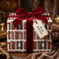Vintage library book wrapping paper by Wrapped Studios, featuring a luxury red velvet bow and gift tag.