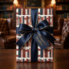 Vintage book wrapping paper with a luxury navy blue ribbon and Wrapped Studios gift tag.