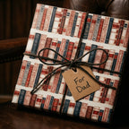 Vintage book wrapping paper by Wrapped Studios on a Father’s Day gift with a rustic twine bow.