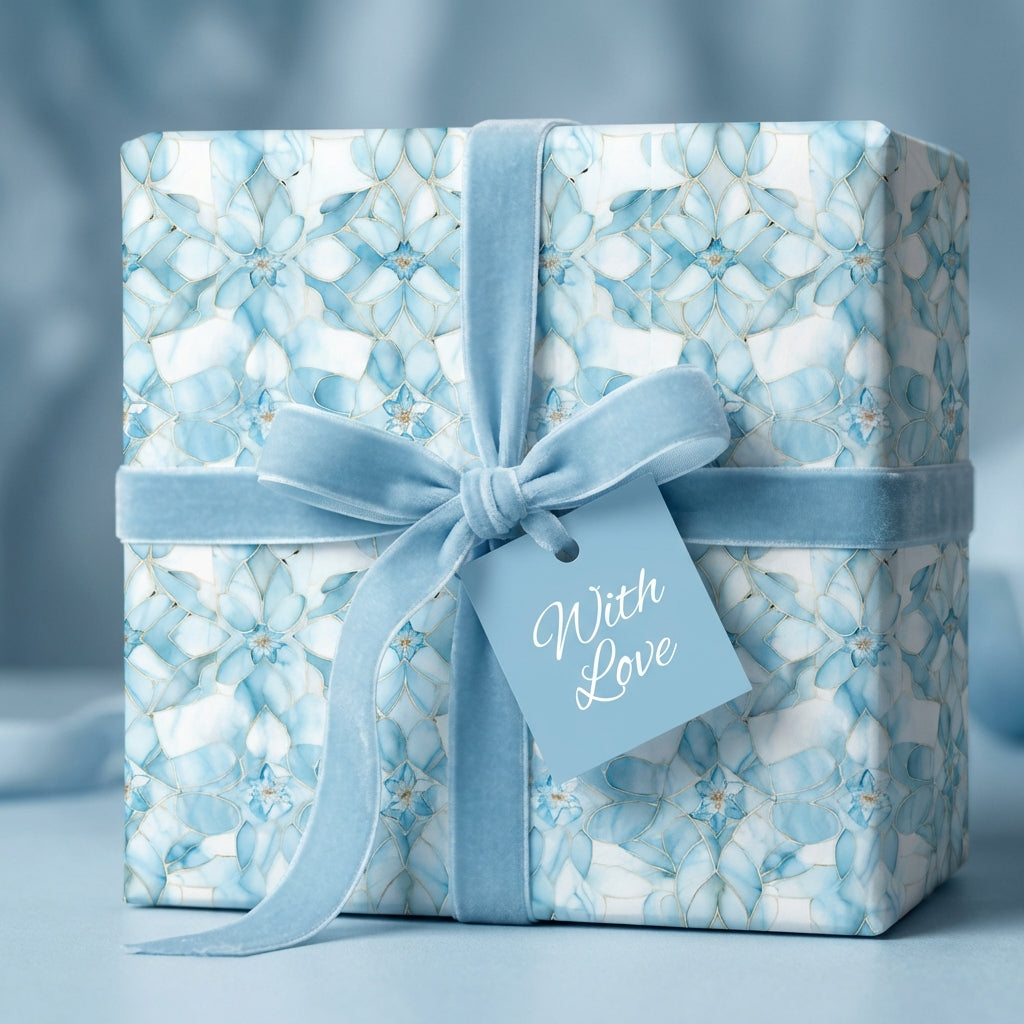 Elegant gift wrapped in blue floral wrapping paper with velvet ribbon and "With Love" tag.