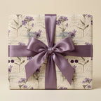 Elegant floral wrapping paper with a lavender satin ribbon bow.
