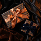 Luxury black and copper wrapping paper with elegant satin and velvet bows, by Wrapped Studios.