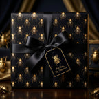 Elegant black gift wrapped in beetle-print paper with a black satin bow and "For You, My Treasure" gift tag.