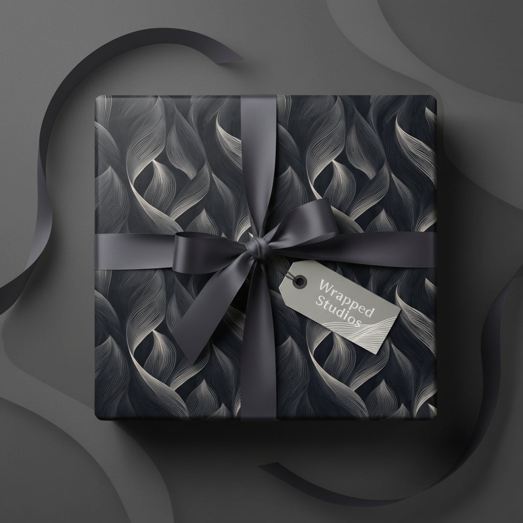 Elegant gift box wrapped in black & silver floral wrapping paper with gray satin ribbon bow.