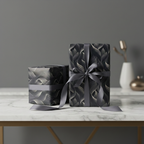 Elegant gifts wrapped in modern gray wave pattern wrapping paper with matching ribbon.