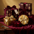 Wrapped Studios presents luxury Christmas gift wrap with elegant ornament pattern and velvet ribbon.