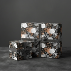 Elegant floral wrapping paper in black, white and copper with gray velvet ribbons, perfect for luxury gift wrap.