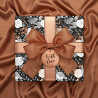 Elegant floral wrapping paper with copper ribbon, "With Love" tag, and silky bronze background.
