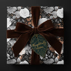 Elegant floral wrapping paper with brown velvet ribbon, perfect for luxury gift wrap.