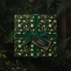 Elegant gift wrapped in floral wrapping paper with green velvet ribbon and "Thank You" tag.
