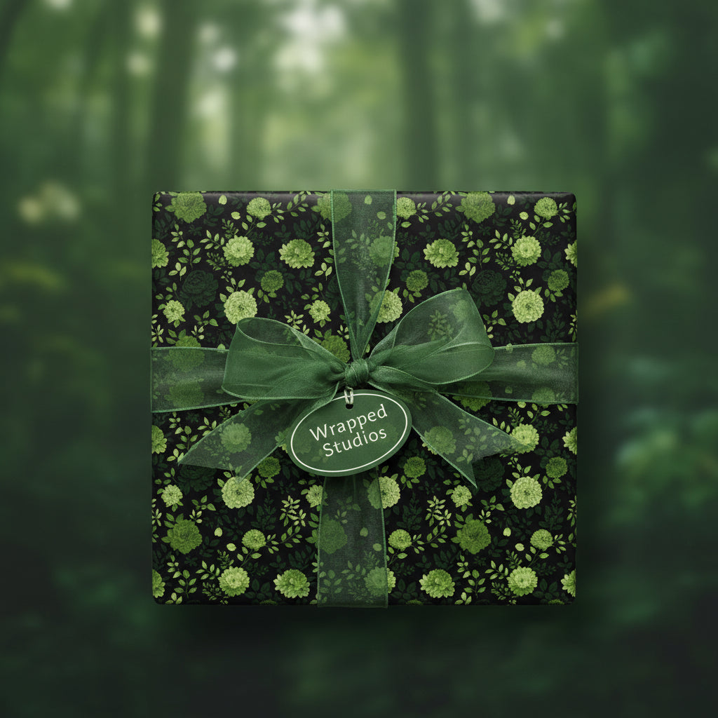 Elegant gift box wrapped in green floral wrapping paper with sheer ribbon bow for nature lovers.
