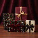 Elegant gift wrapping paper: burgundy, black, and cream boxes with ribbon bows for Christmas, birthdays, and special occasions.