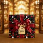 Elegant black gift box wrapped in polka dot Christmas wrapping paper with red ribbon and gold bow.