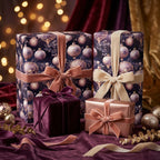 Decorative luxury purple gold Christmas gift boxes with festive wrapping and ribbons on a purple fabric background with blurred lights.