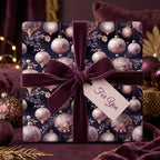 Elegant Christmas gift wrapped in ornament-patterned paper with a velvet purple ribbon.