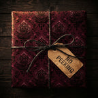 Burgundy floral wrapping paper with a "No Peeking" gift tag and simple twine bow.